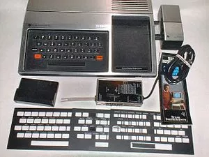 1979_TI-99-4_with_Speech_Synthesizer,_RF_modulator,_keyboard_overlays_(adjusted).jpg