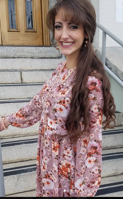 Nurie at rehersal in Jills dress.png