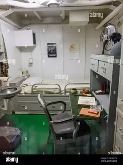 captains-quarters-or-state-room-for-the-captain-of-the-uss-alabama-battleship-showing-a-writi...webp